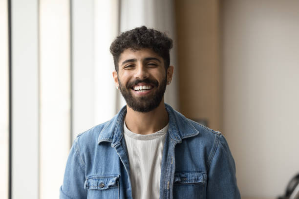 istock Positive handsome Arab entrepreneur man standing for shooting indoors 1917869315