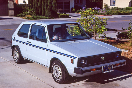 Blue 1980 Volkswagen Rabbit parked in driveway. California, USA. The Rabbit was called the Volkswagen Golf Mk1 in Europe.