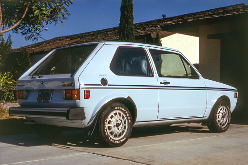 Blue 1980 Volkswagen Rabbit parked in driveway. California, USA. The Rabbit was called the Volkswagen Golf Mk1 in Europe.