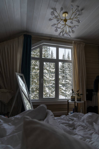 istock Winter cozy bedroom Interior with window blinds 1917878236