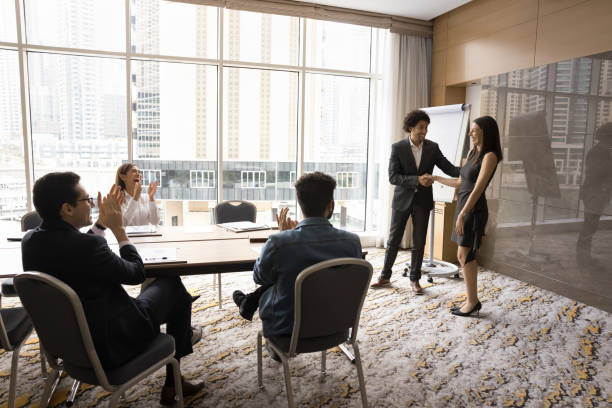 istock Cheerful Arab business leader shaking hands with best successful manager 1917881466