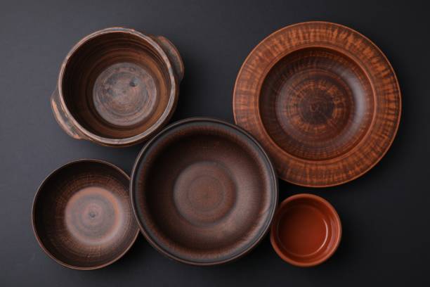 istock Bowls and plates on black background, flat lay 1917886694