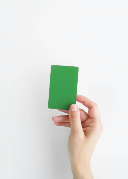 istock hand holding a blank green plastic card 1917898757