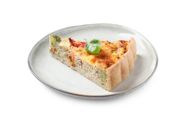 istock Tasty quiche with chicken, cheese, basil and vegetables isolated on white 1917922299