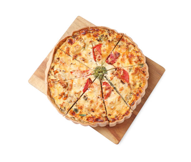 istock Board with tasty quiche isolated on white, top view 1917922821