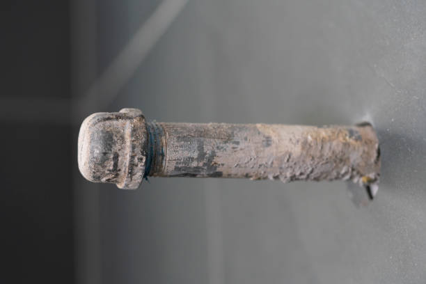 istock Water pipe in bathroom wall during home remodel. 1917927974