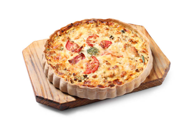 istock Tasty quiche with tomatoes and cheese isolated on white 1917927992
