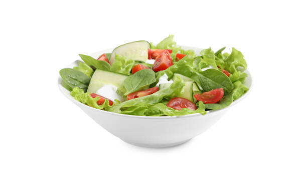istock Delicious salad with lettuce, tomatoes and spinach isolated on white 1917933657