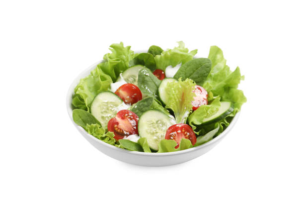 istock Delicious salad in bowl isolated on white 1917934707