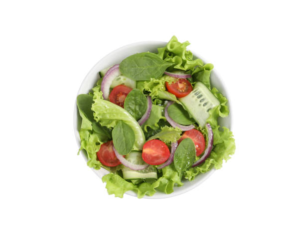 istock Delicious vegetable salad isolated on white, top view 1917935226