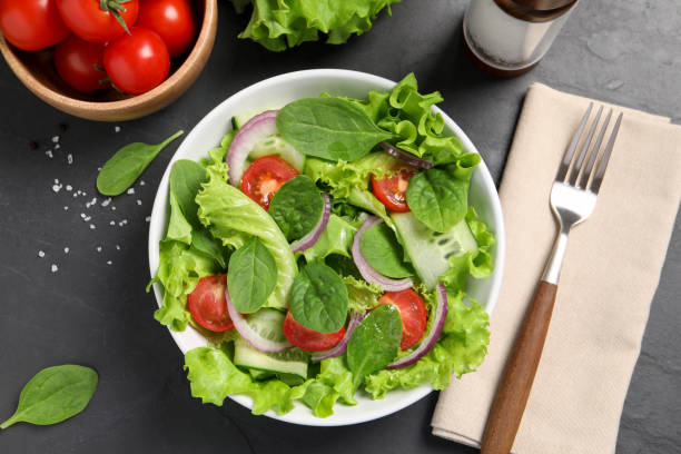 istock Delicious vegetable salad served on grey table, flat lay 1917940357