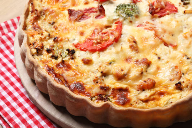 istock Tasty quiche with tomatoes and cheese on table, closeup 1917966050