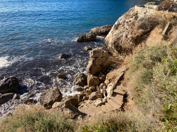 istock Rocky shoreline with blue sea 1917986786