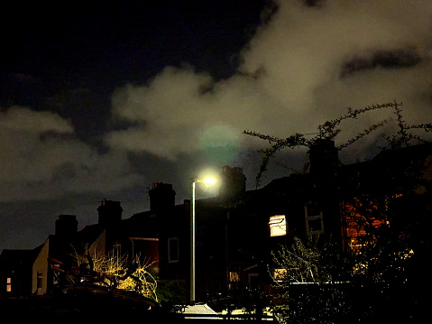 Street of terraced houses in Norwich at night. January 2024