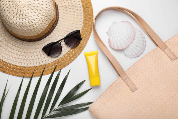 istock Flat lay composition with sunscreen and beach accessories on white background 1918070757