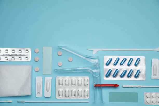 istock Sterile gynecological examination kit and pills on light blue background, flat lay. Space for text 1918079508