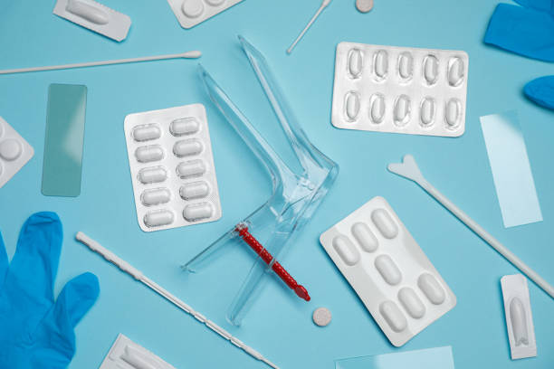 istock Sterile gynecological examination kit and pills on light blue background, flat lay 1918081108