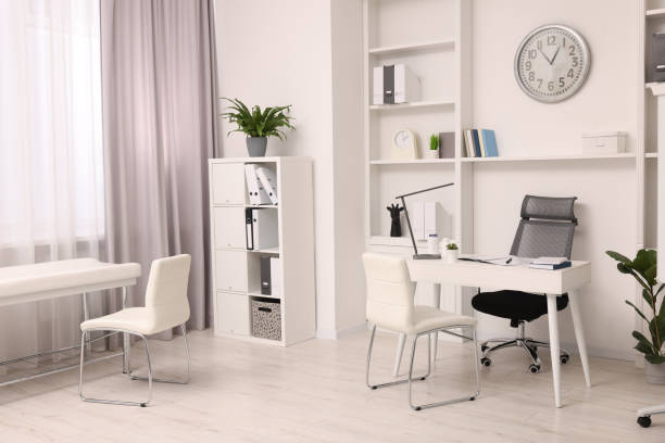 istock Modern medical office interior with doctor's workplace and examination table 1918094638