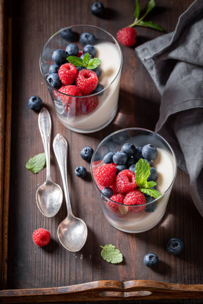 istock Delicious and cold Panna Cotta with blueberries and raspberries. 1918097824