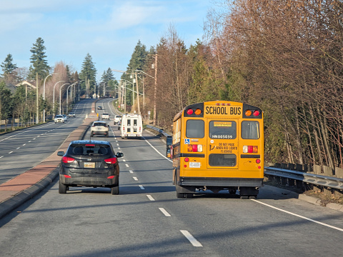 Traffic heads northwest on the Fraser Highway in the Fleetwood neighbourhood of Surrey, British Columbia. Autumn morning in Metro Vancouver.