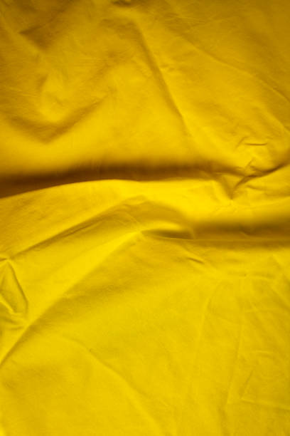 istock creased fabric in easter yellow 1918109576