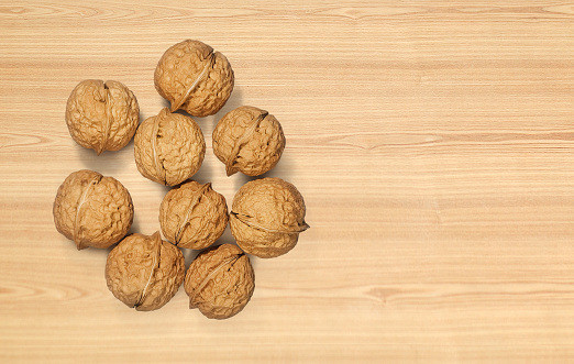 Walnuts on wooden background. Top view.