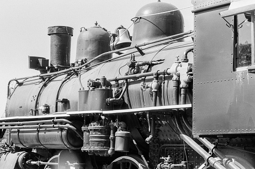 Journey into the past with a vintage steam engine captured in black and white at a museum. A nostalgic glimpse into the industrial elegance and historic charm of Santa Clarita's railway heritage.