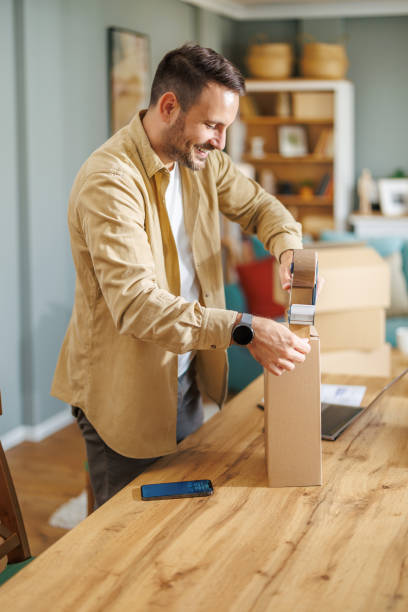 istock Small business owner packing in the cardbox at workplace 1918158505