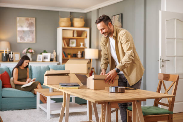 istock Small business owner packing in the cardbox at workplace 1918159543