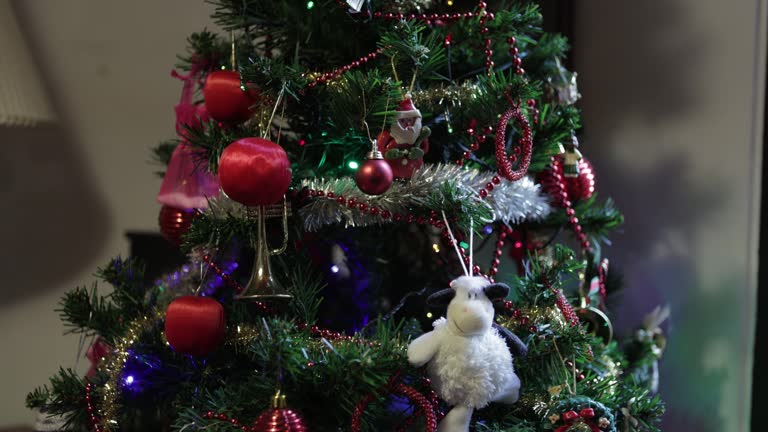 Close-up of an Artificial Christmas Tree Decorated With LED Lights in a Middle-Class Apartment