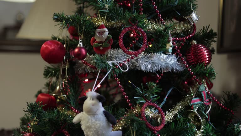 Close-up of an Artificial Christmas Tree Decorated With LED Lights in a Middle-Class Apartment