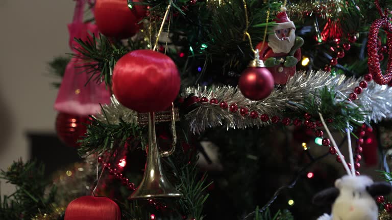 Close-up of an Artificial Christmas Tree Decorated With LED Lights in a Middle-Class Apartment