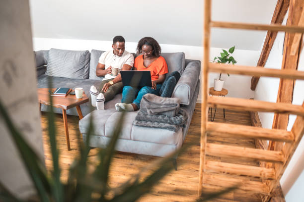 istock Professional Couple of Black-American Web Software Developers Working From Home 1918297547