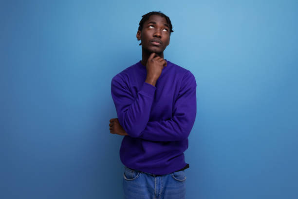 istock insecure black american young guy with dreadlocks in casual clothes 1918298660