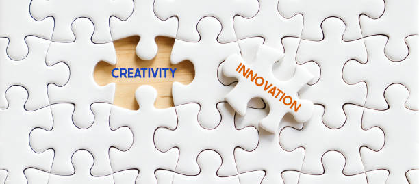 istock Creativity and Innovation word on white puzzle background, success in business concept 1918322406