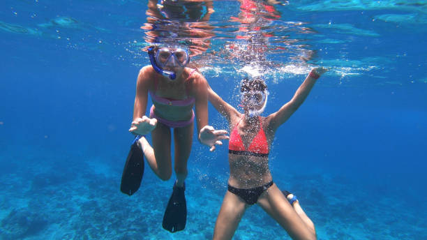 istock Mother and daughter snorkelling 1918348343