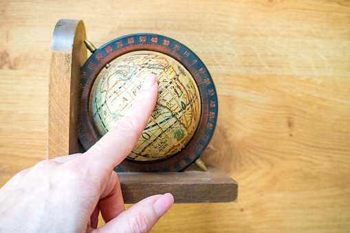 Hand catch and Finger point Globe, whole world.Travel , Adventure and Discovery concept. High quality photo