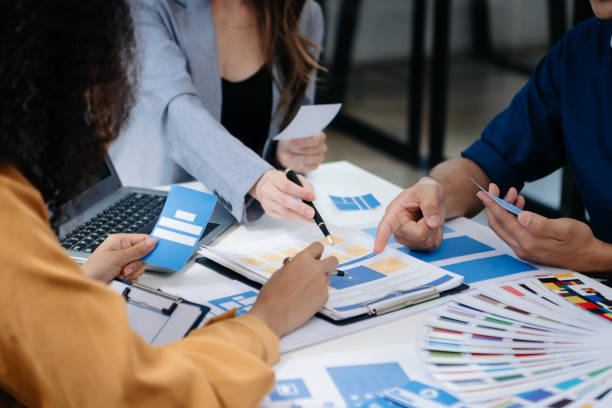 istock UI developer team brainstorming on their project with laptop, smartphone and digital tablet. Creative digital development agency. 1918402642