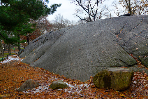 Rock slide in Manhattan Park in New York, layered geological formation, USA