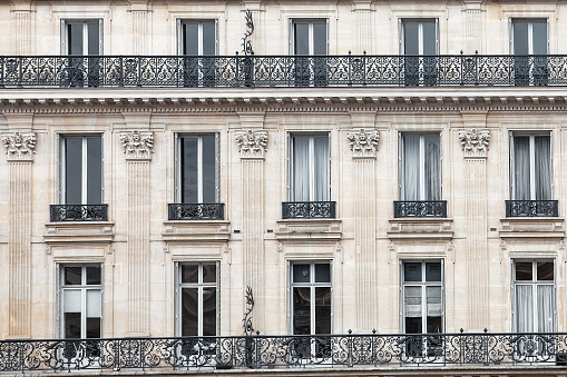 Detail of the facade with windows of a building in Paris, France