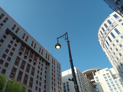 Downtown district at sunset against blue sky