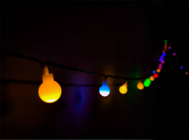 istock colorful light bulbs in foreground and background 1918503295