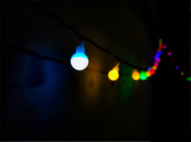 istock colorful light bulbs in foreground and background 1918509524