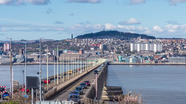 City skyline of Dundee and the Tay Road Bridge over River Tay, Dundee, Scotland - 4k time lapse