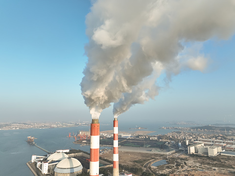Industrial chimney emitting exhaust gas