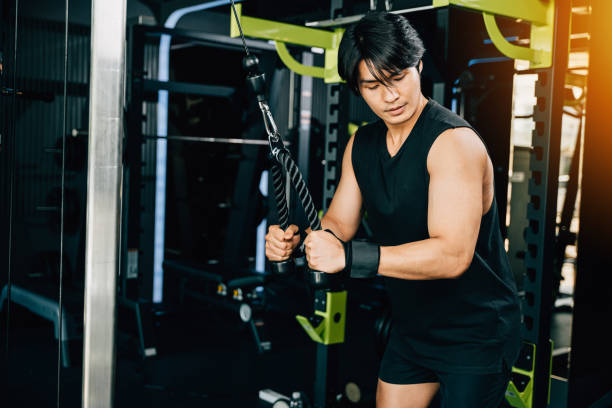 istock Young man performing cable triceps pulldowns to build muscle and strength 1918533612