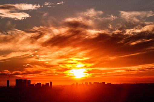 Firey red sky above Los Angeles with city silhouette