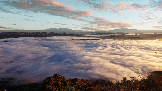 Overlooking the fog-filled Elsinore Valley at sunrise in southern California near sunrise