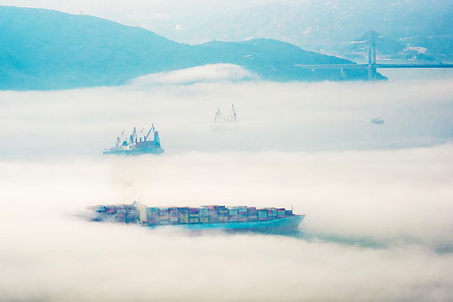 Aerial view of cargo ship in fog