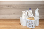 Chemical detergent bathroom laundry hygiene cleaning plastic basket storage organizing wooden table